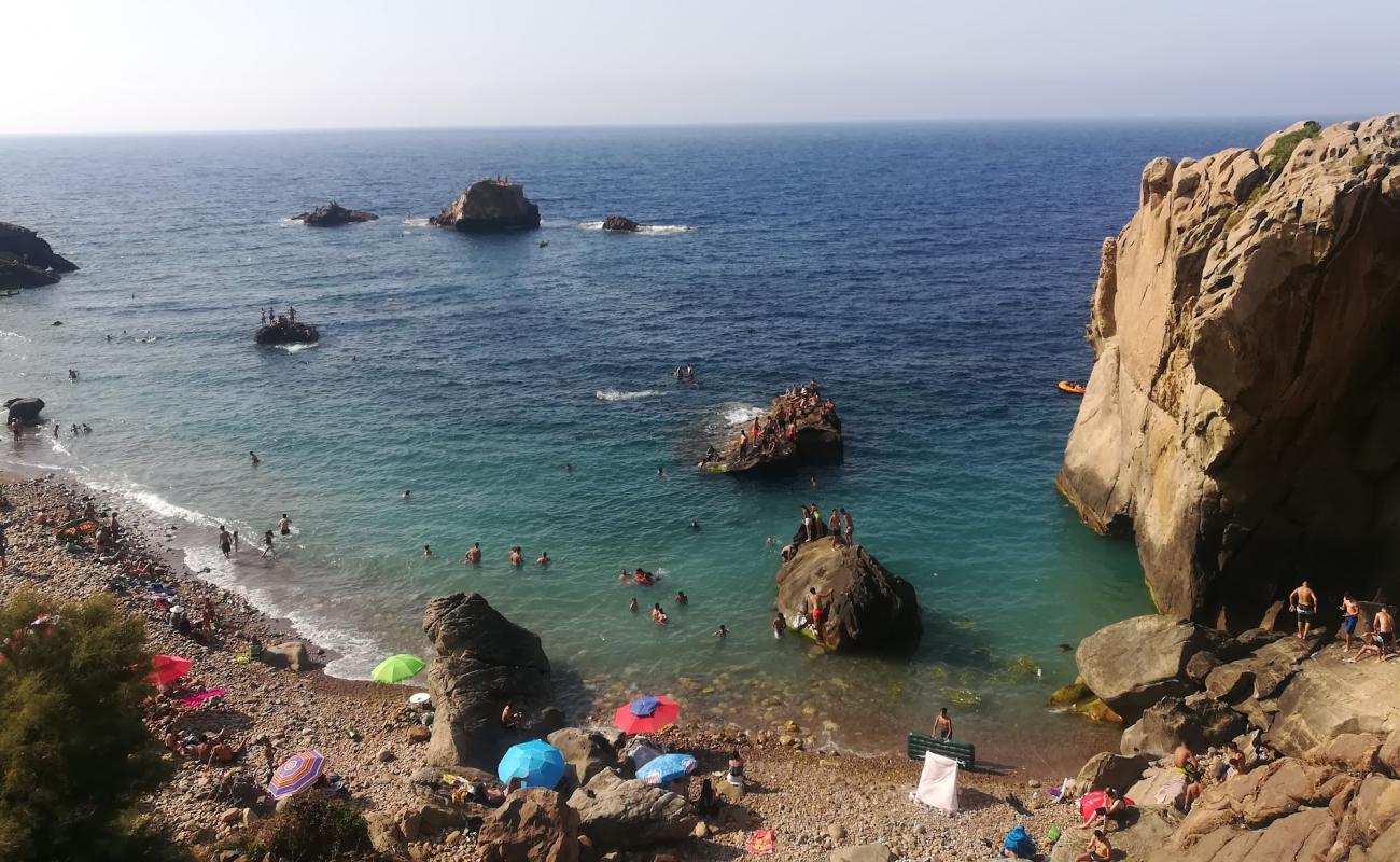 Photo de Plage tiza avec caillou brun de surface