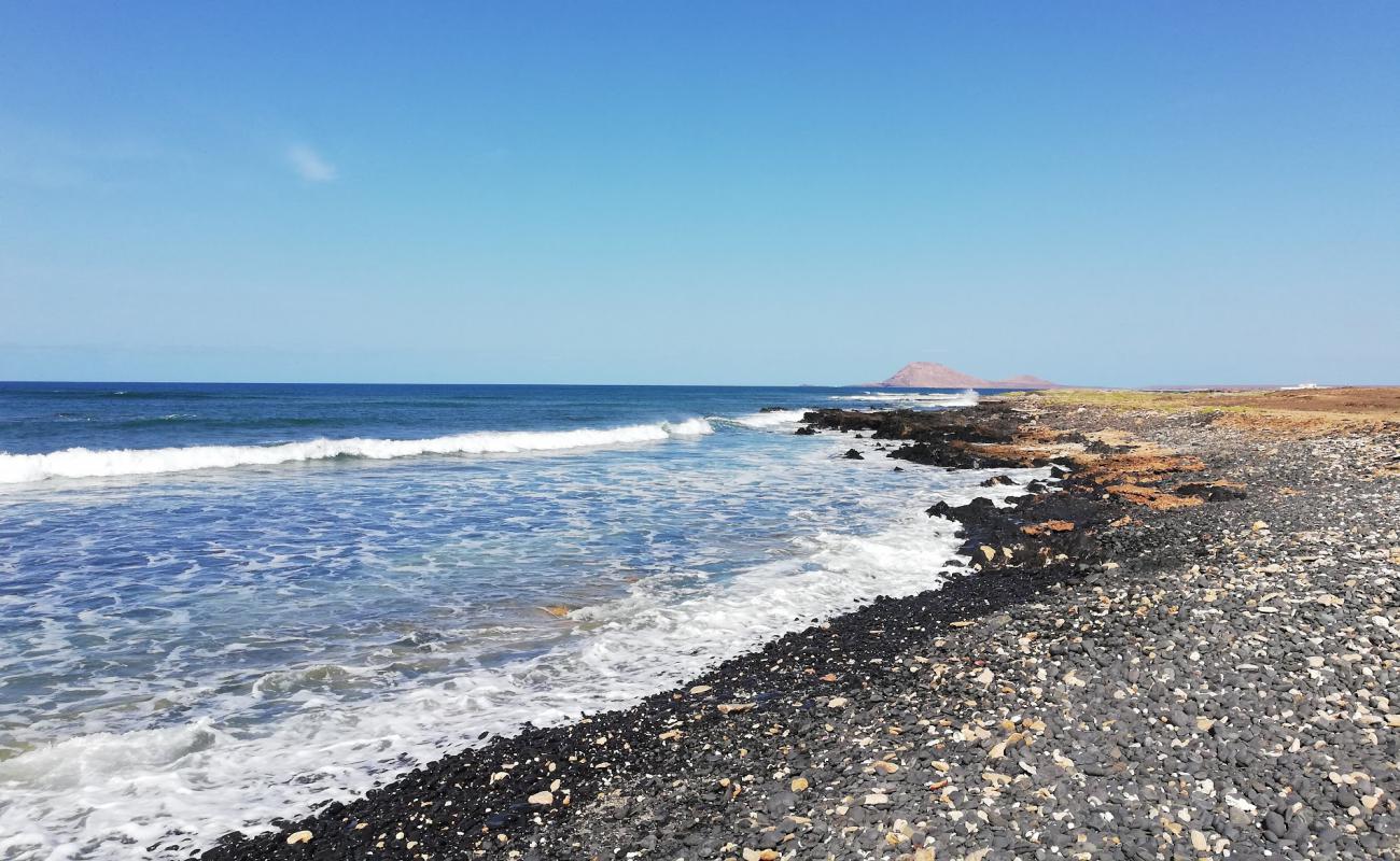 Photo de Black Beach avec sable gris avec roches de surface