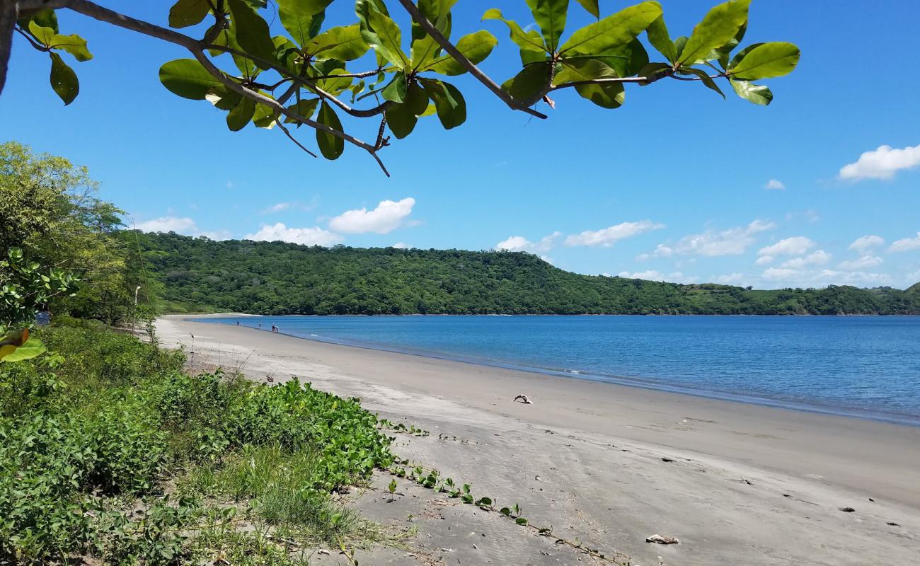 Photo de Iguanita beach avec sable beige de surface