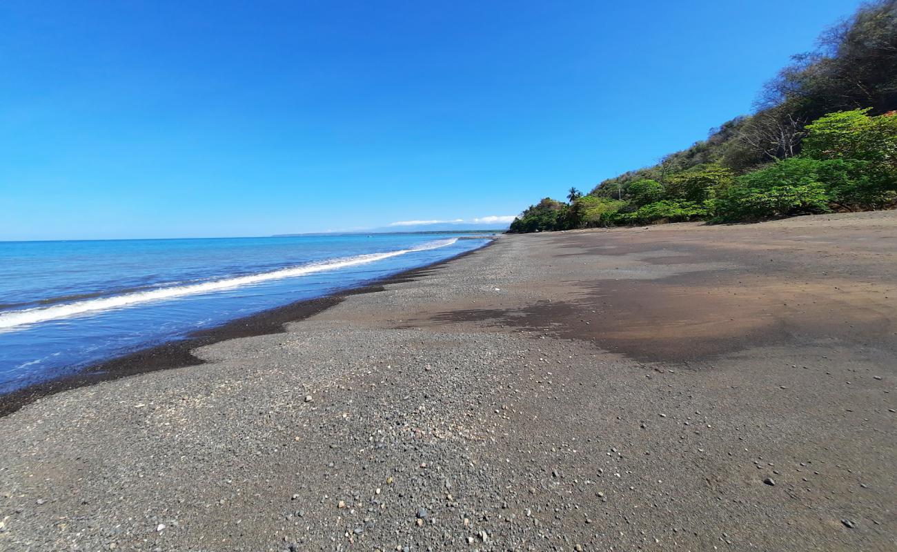 Photo de Playa Pogeres avec sable brun de surface