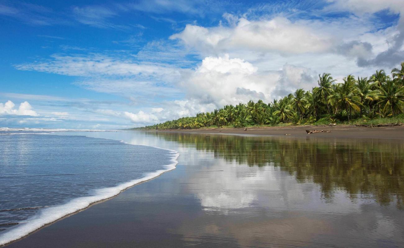 Photo de Playa Palo Seco avec sable gris de surface