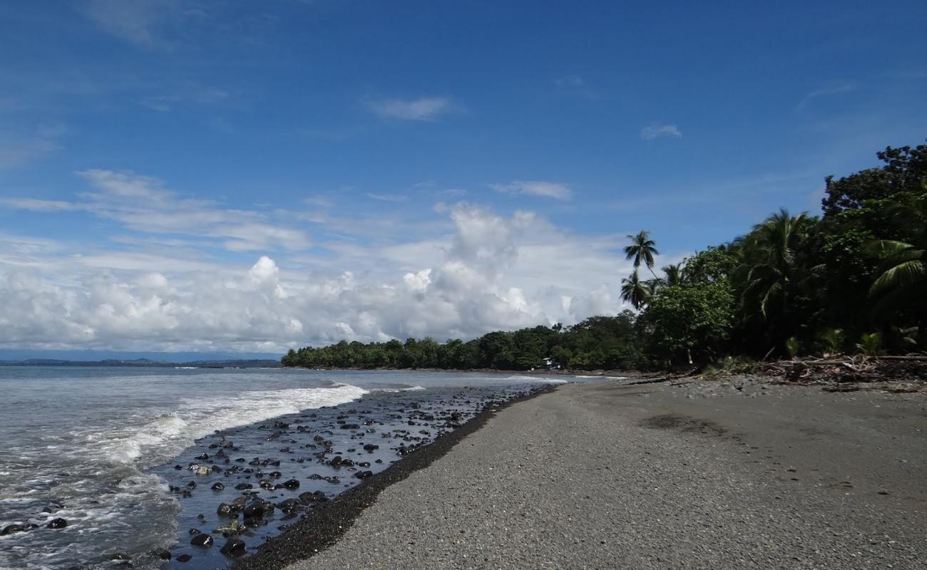 Photo de Playa Pavones avec galets bruns de surface