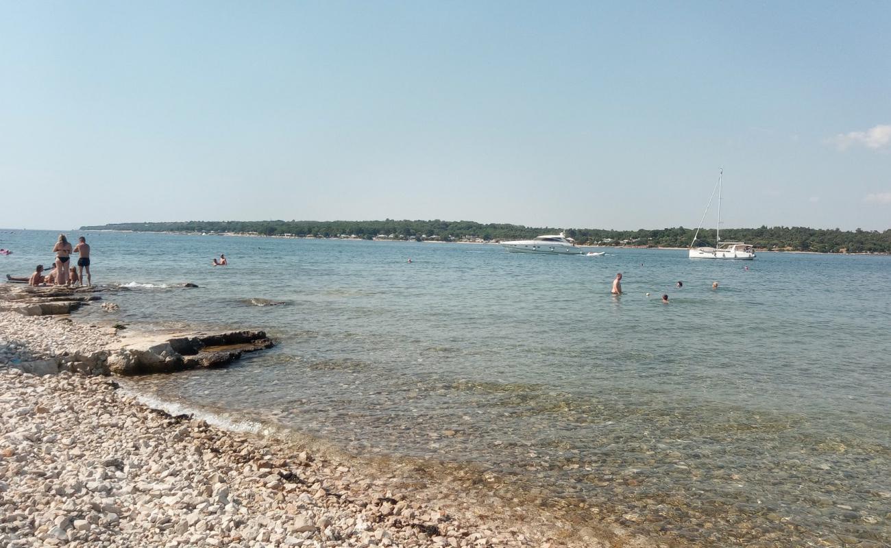 Photo de Porat beach avec caillou clair de surface