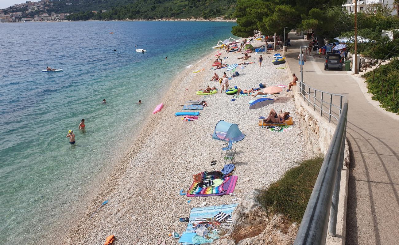 Photo de Porat beach avec caillou clair de surface