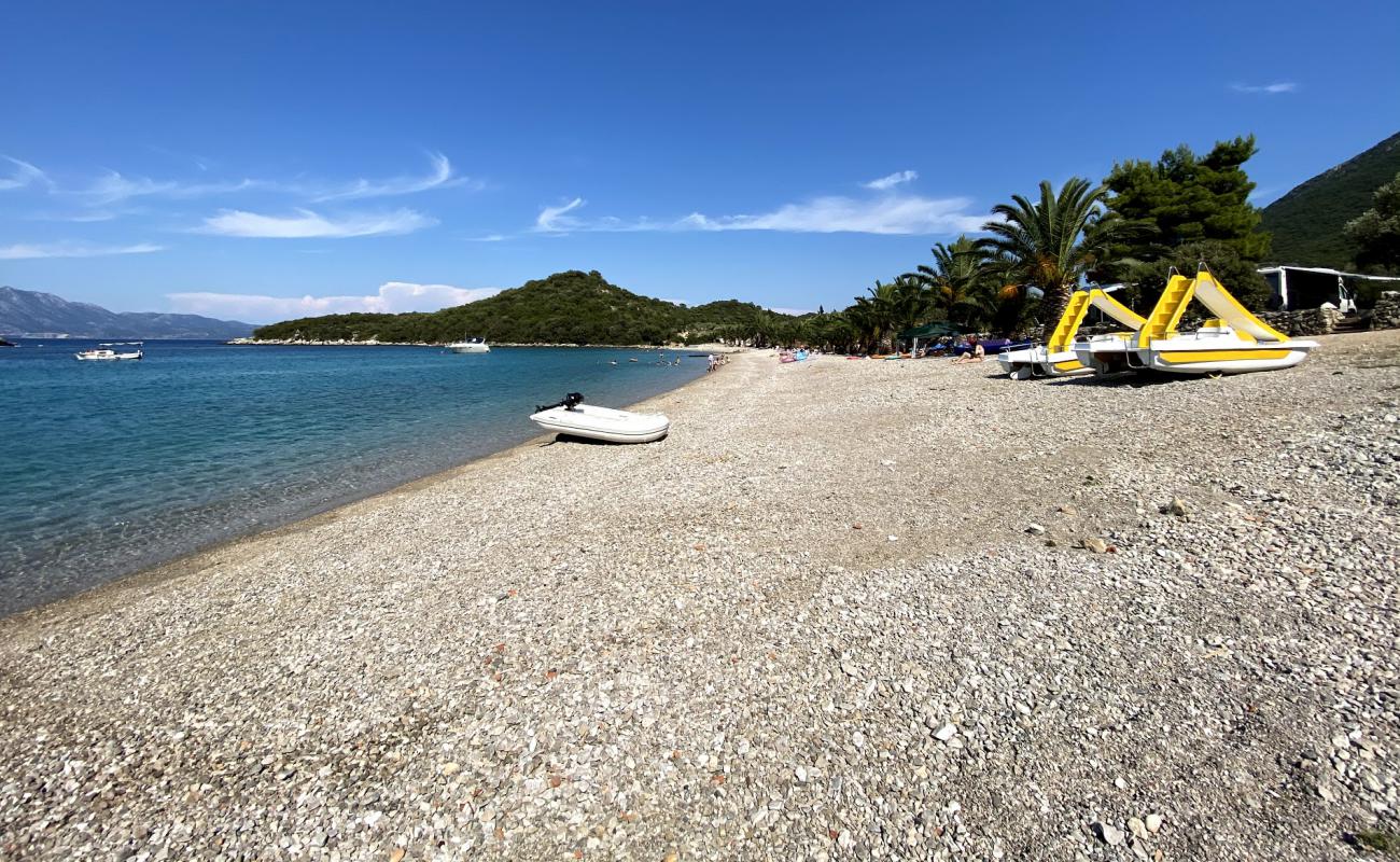 Photo de Pozora II beach avec caillou fin brun de surface