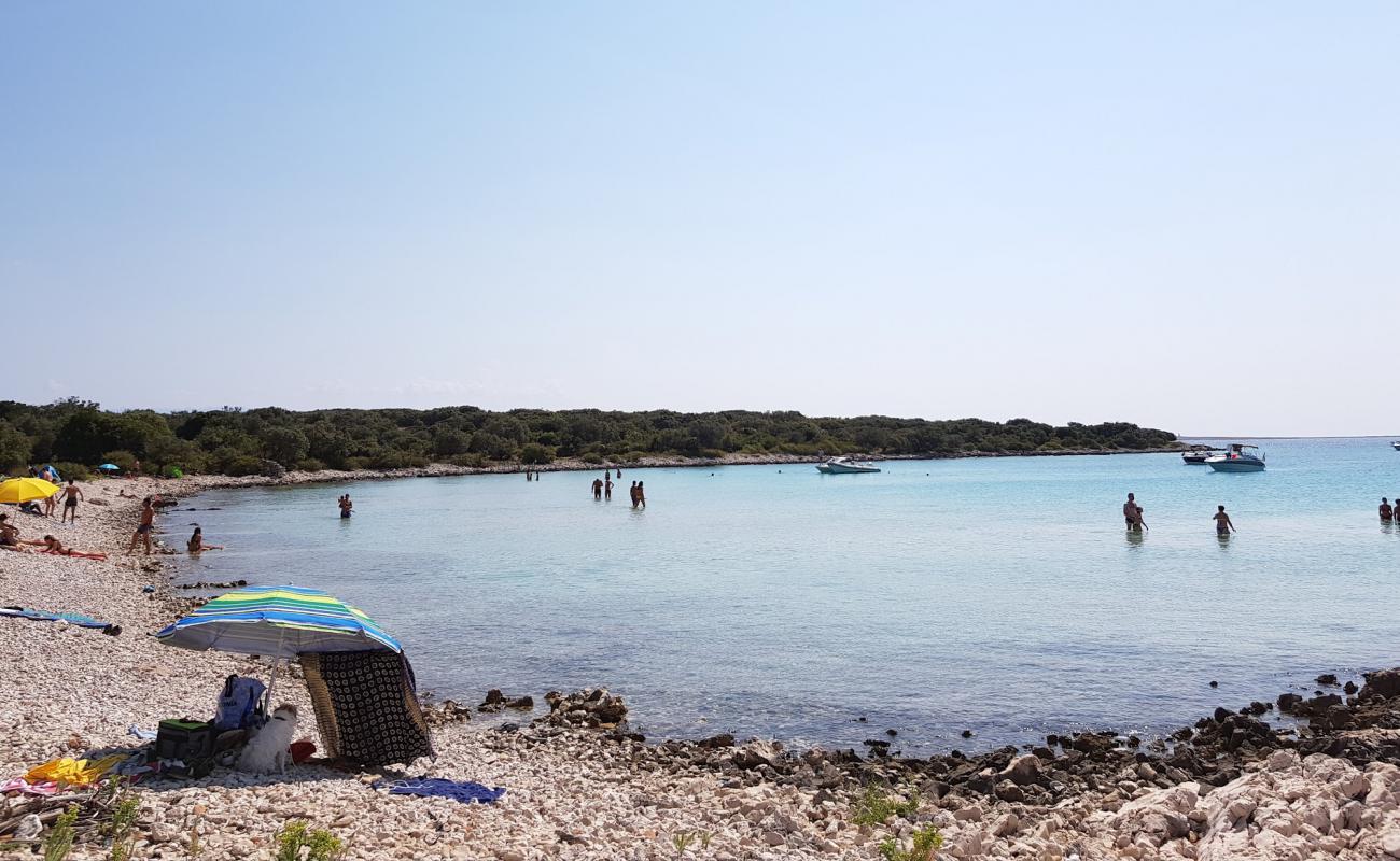 Photo de Meli beach avec galets beige de surface