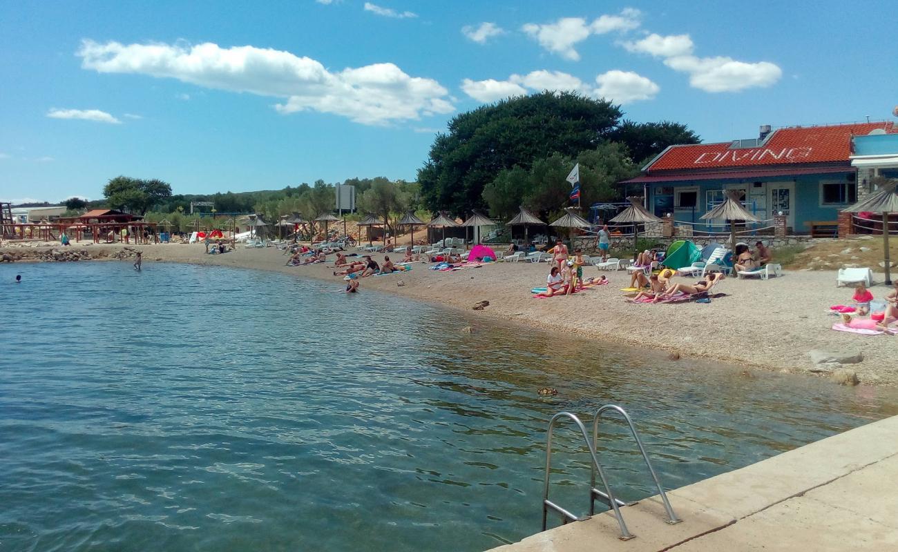 Photo de Dunat beach avec caillou fin clair de surface