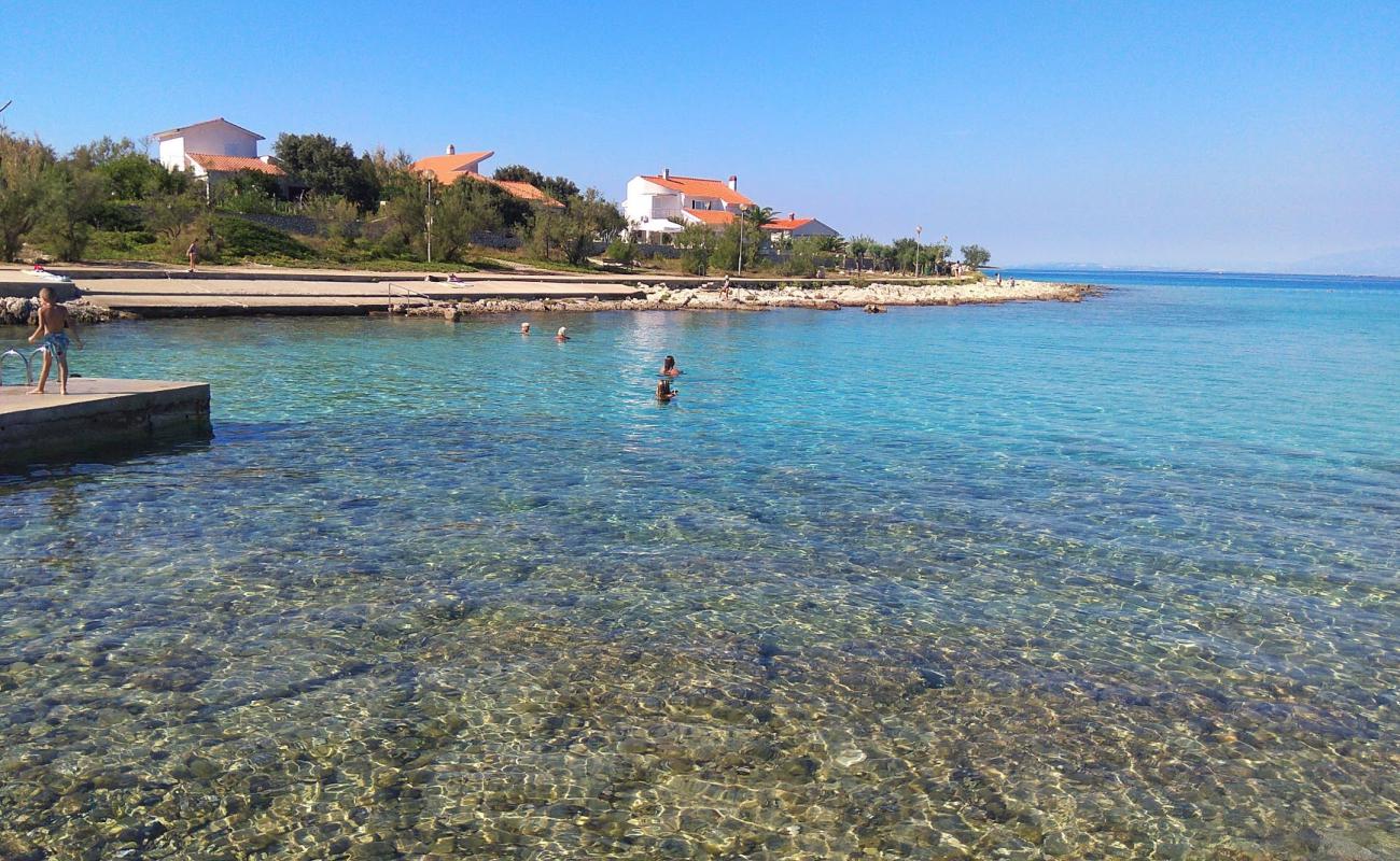 Photo de Sotorisce beach avec galets beige de surface