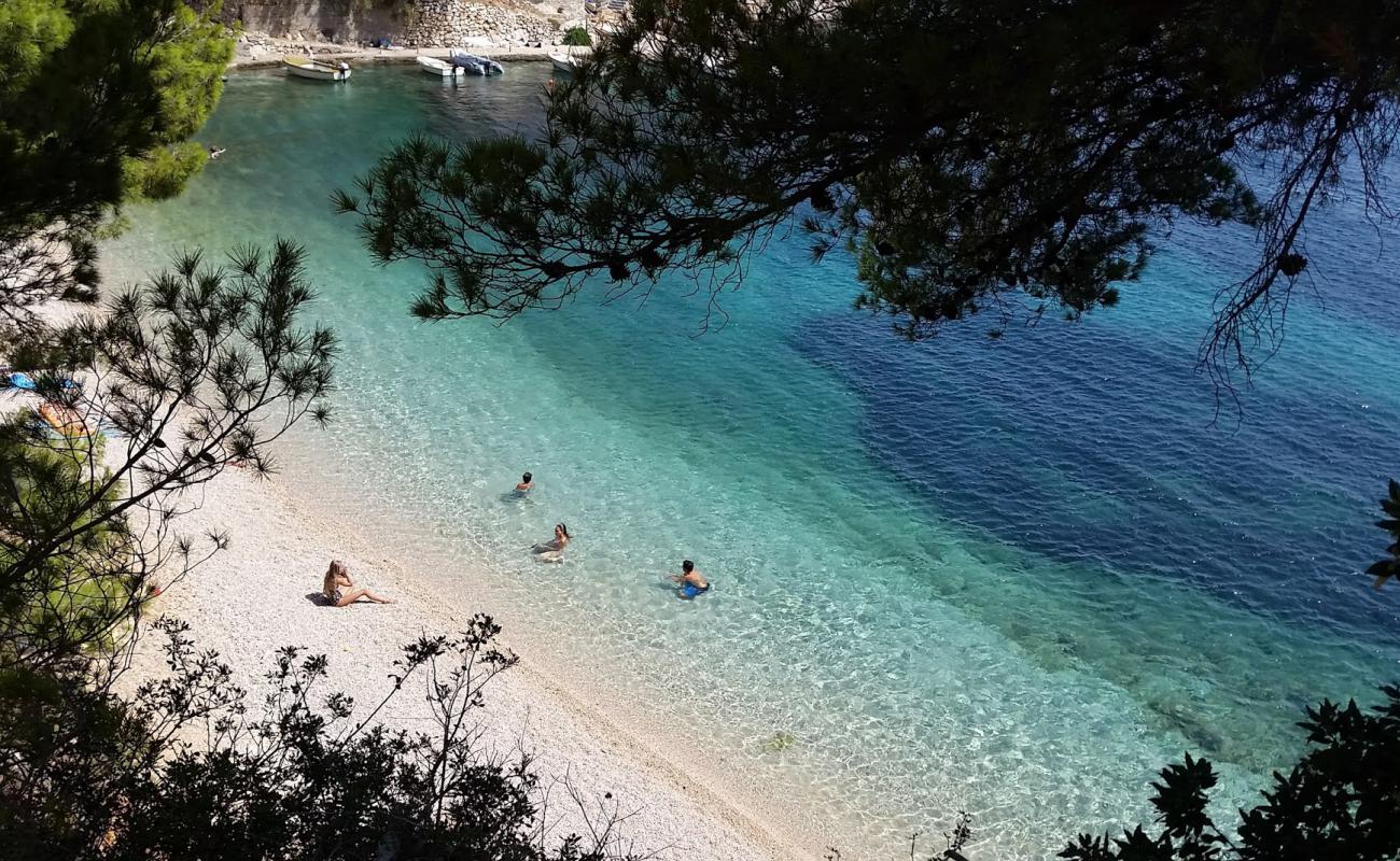 Photo de Kozja beach avec caillou fin clair de surface