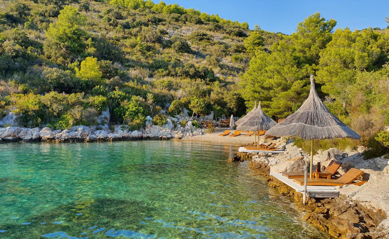 Photo de Calma beach avec galets beige de surface