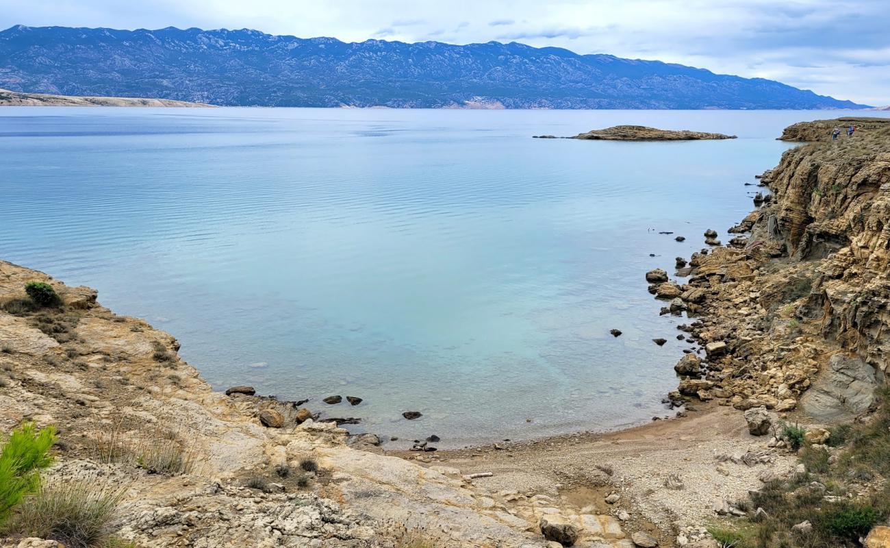 Photo de FKK Potpecna beach avec terrain rocheux de surface