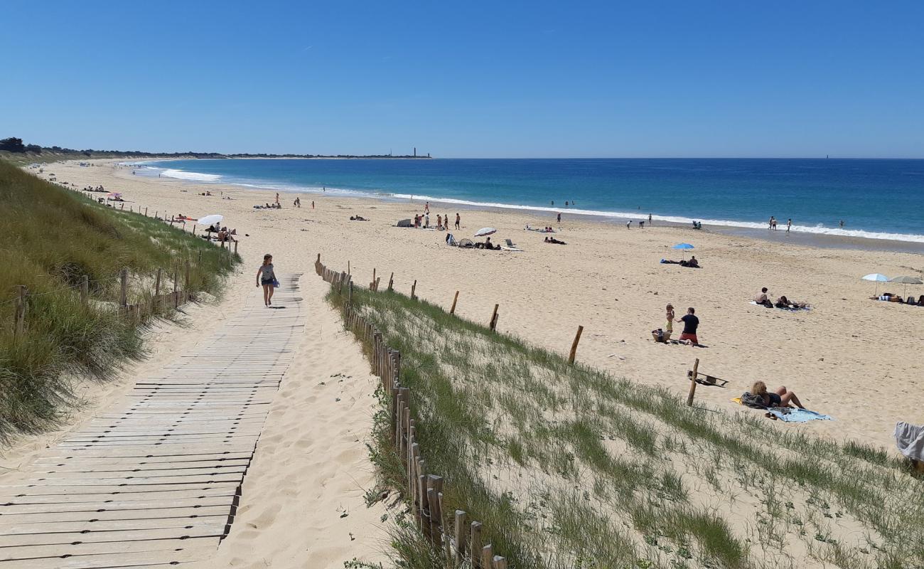 Photo de Petit Bec beach avec sable lumineux de surface