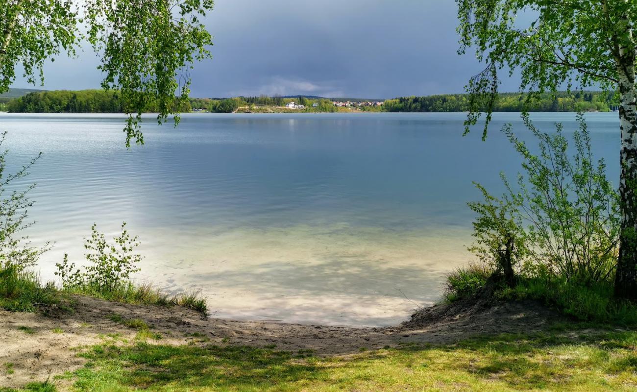 Photo de Badestrand avec sable beige de surface