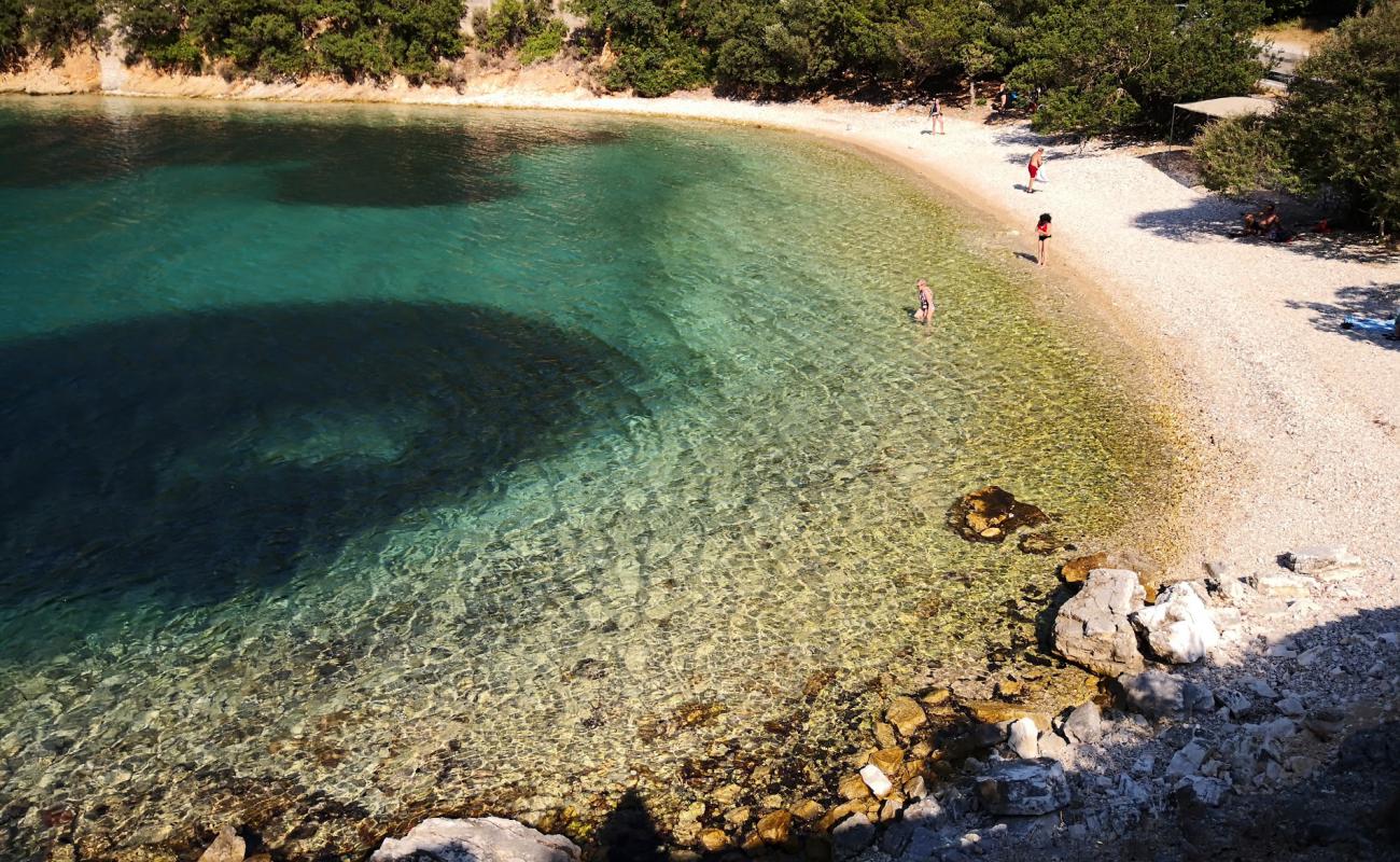 Photo de Kourvoulia beach II avec caillou fin clair de surface