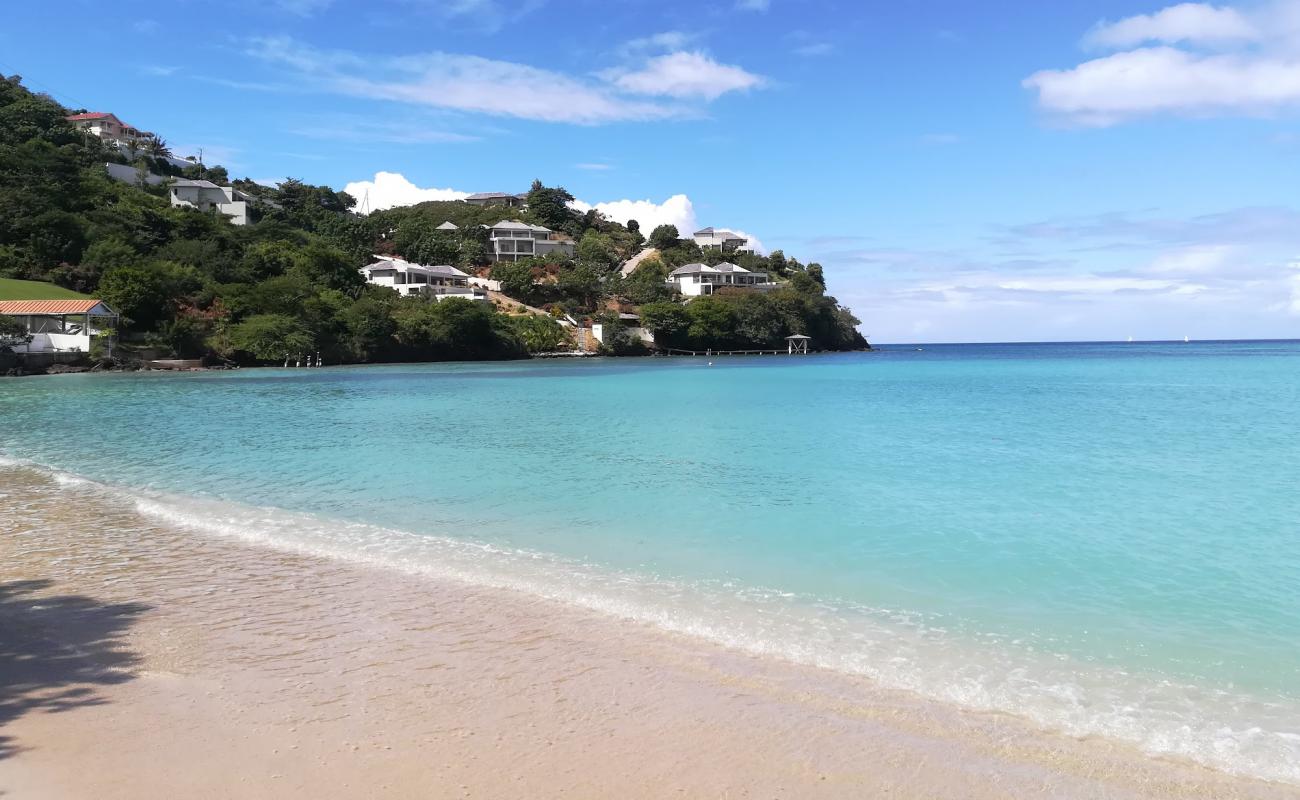 Photo de Morne Rouge beach avec sable beige fin de surface