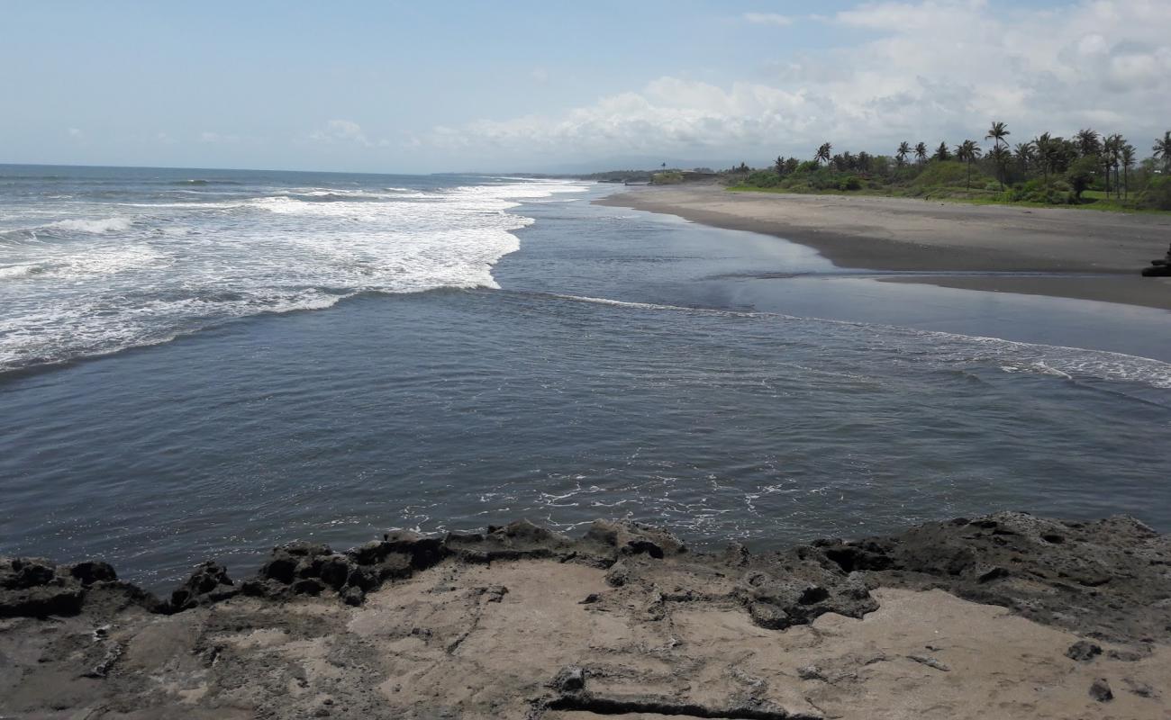 Photo de Pigstone Beach avec sable fin noir de surface