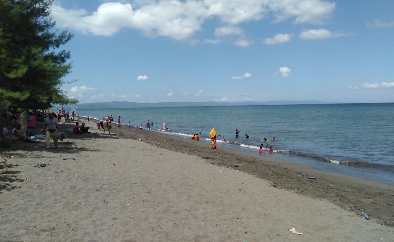Photo de Kuranji Beach avec sable brun de surface