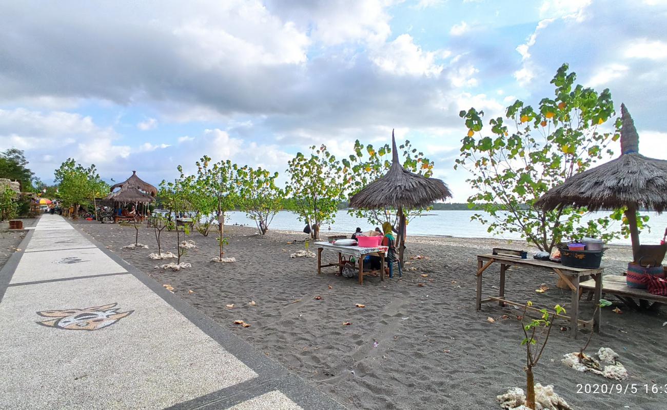 Photo de Impos Beach avec sable brun de surface