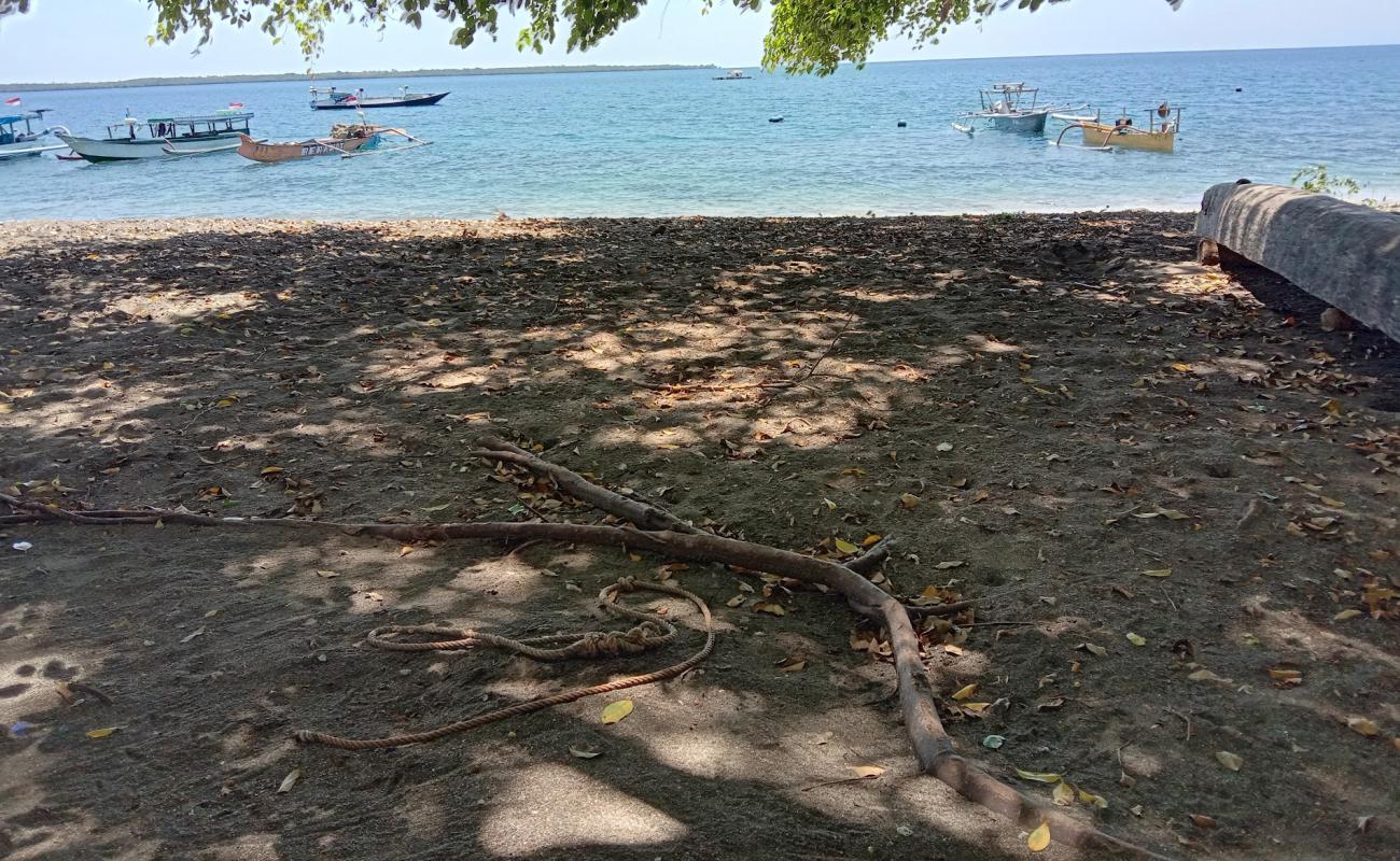 Photo de Dadap Hidden Beach avec sable brun de surface