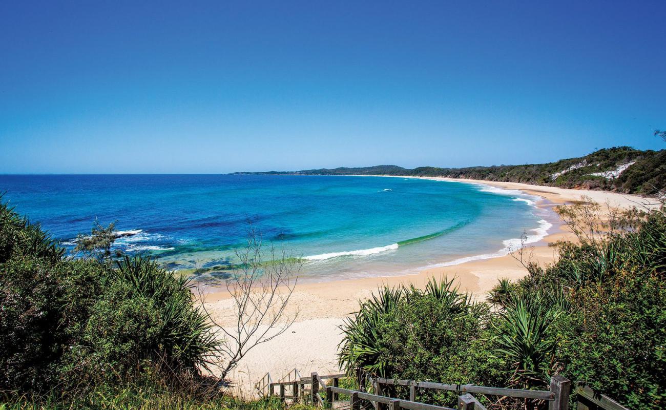 Photo de Wooli Beach avec sable lumineux de surface