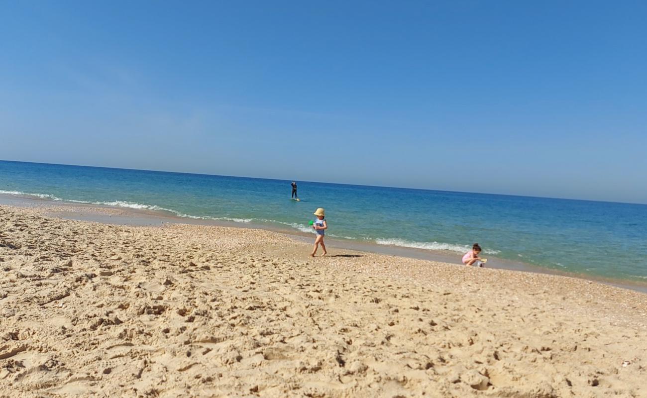 Photo de Zikim beach avec sable lumineux de surface