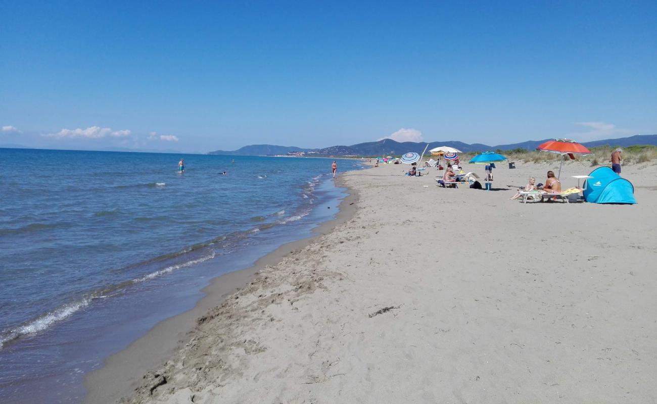 Photo de Sunset Beach avec sable brun de surface