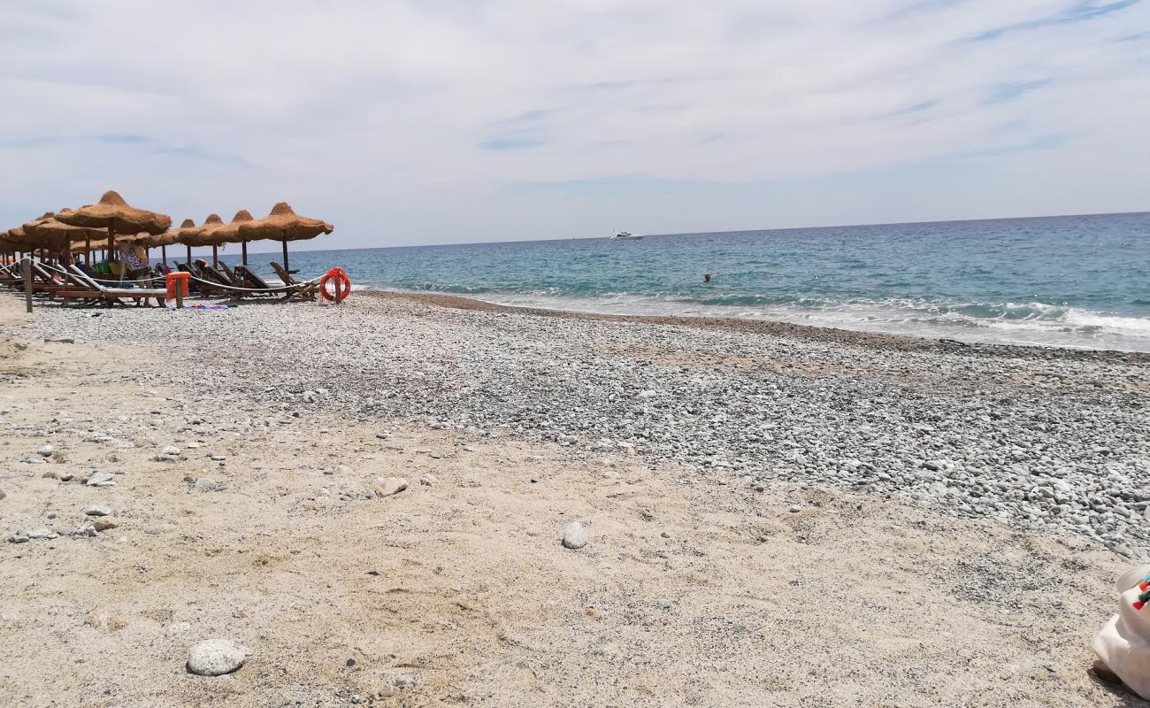 Photo de Riace Marina beach avec caillou fin brun de surface