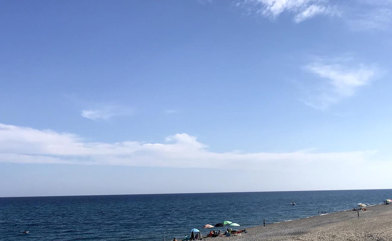 Photo de Torre Ellera beach avec caillou fin brun de surface