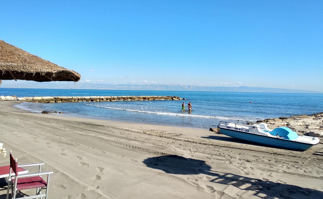 Photo de Caribe Beach avec sable brun de surface