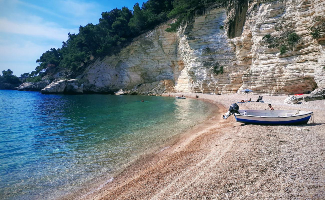 Photo de Plage de Portogreco avec galets beige de surface