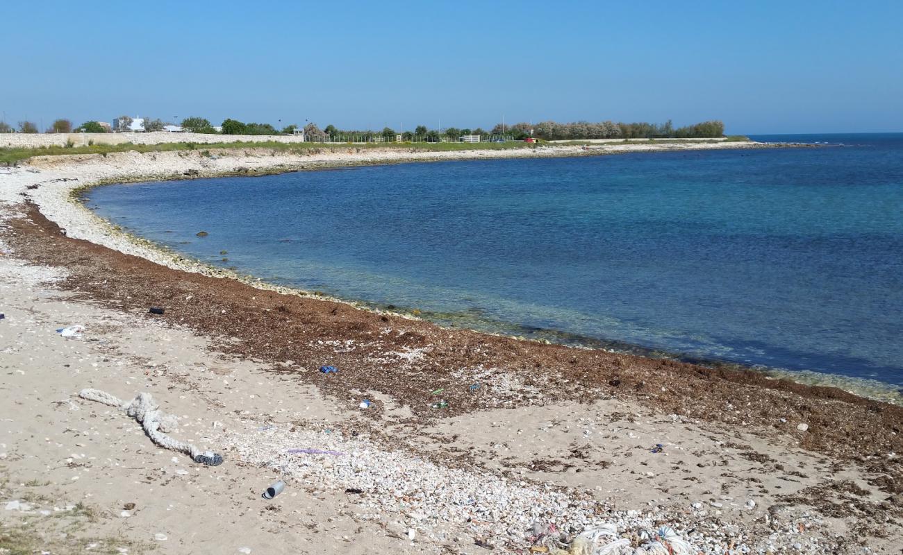 Photo de Cala San Giacomo Beach avec galets gris de surface