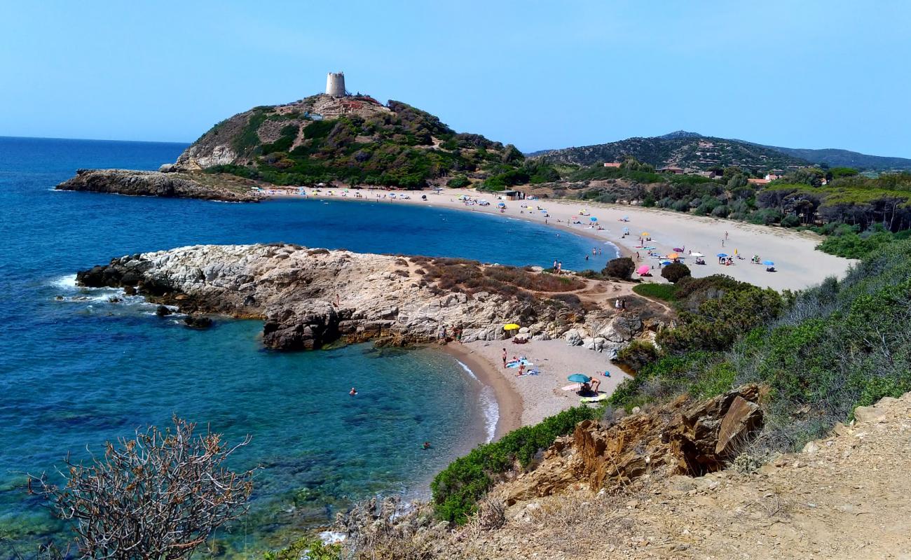 Photo de Spiaggia di Su Portu avec petits galets beige de surface