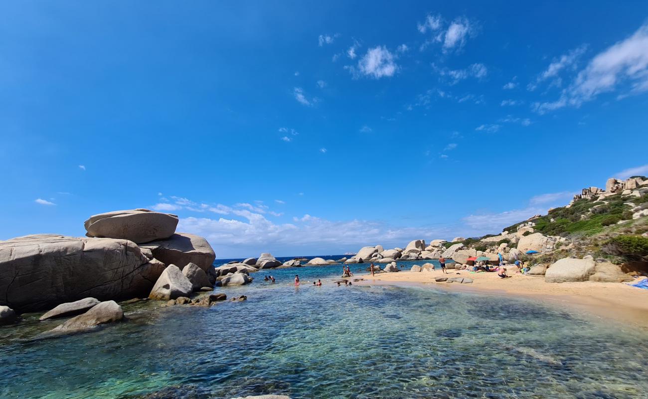 Photo de Plage de Talmone avec sable brun de surface