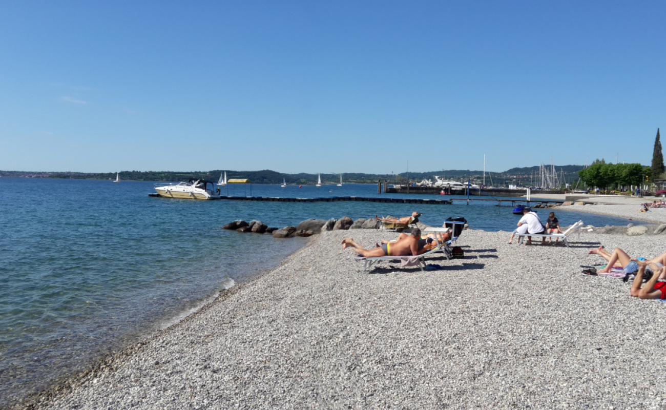 Photo de Spiaggia Porto avec galets gris de surface