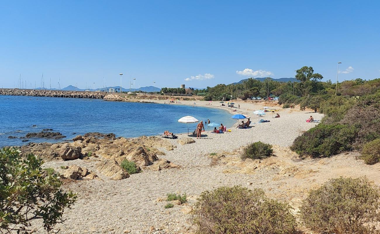 Photo de Porto Corallino Beach avec petits galets beige de surface