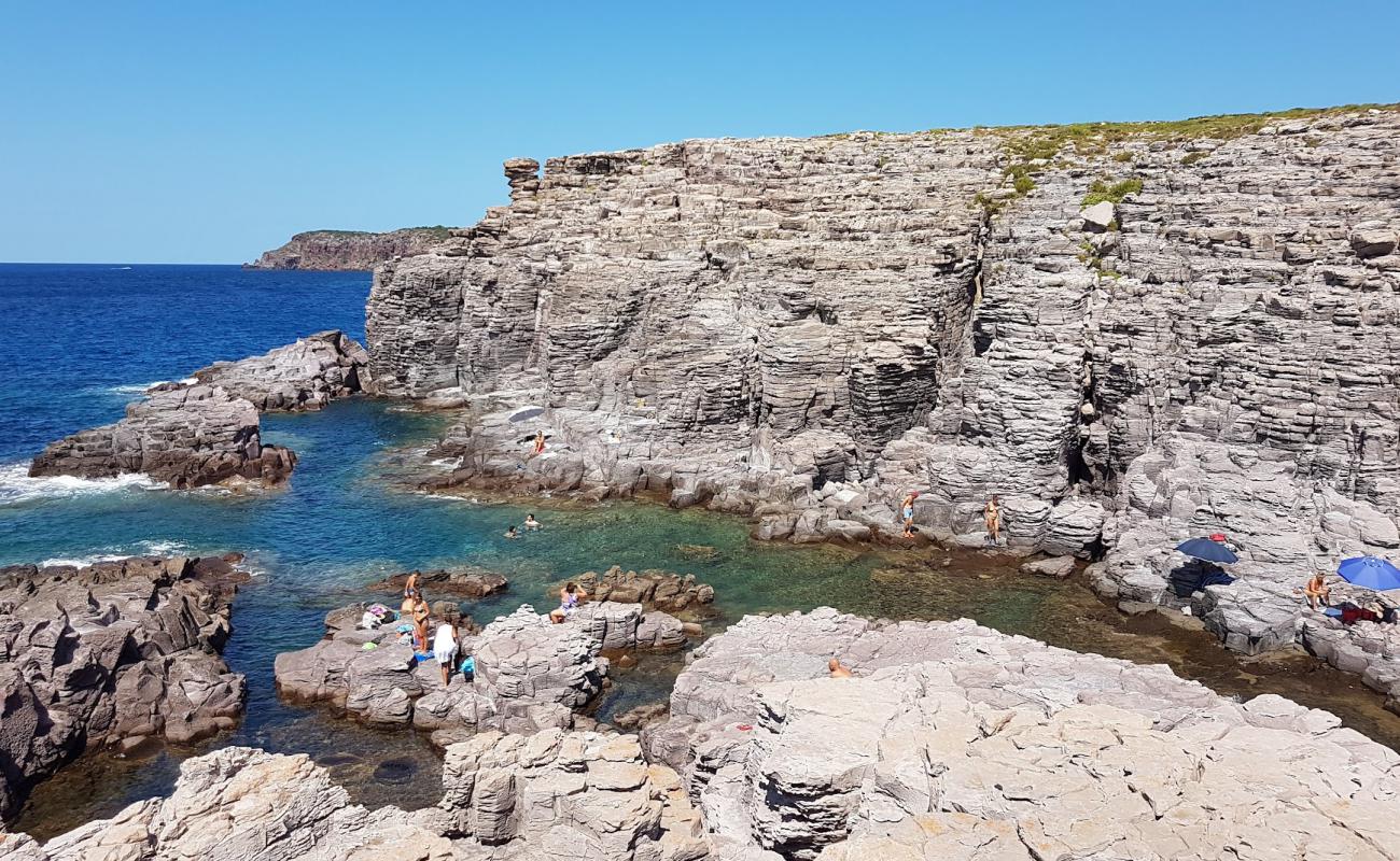 Photo de Conca Beach avec rocky shore de surface