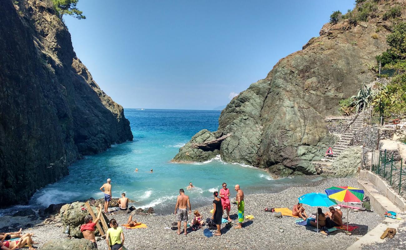 Photo de Spiaggia di Porto Pidocchio avec caillou gris de surface