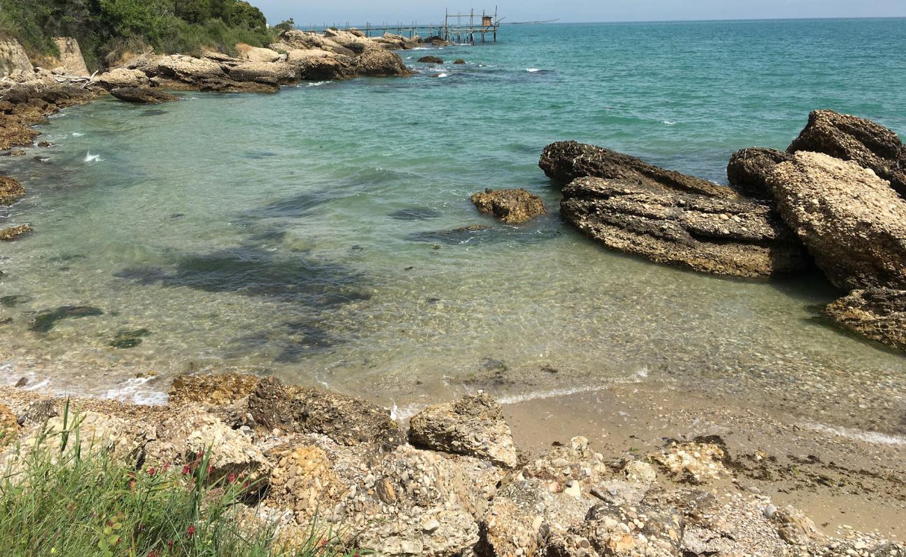 Photo de Torricella Beach avec galets beige de surface