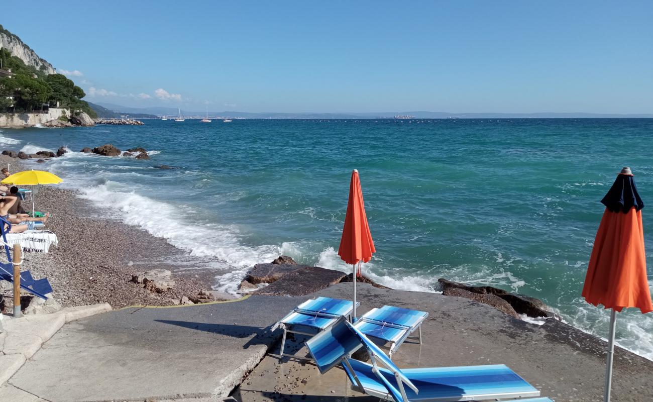 Photo de Spiaggia delle Ginestre avec caillou fin gris de surface