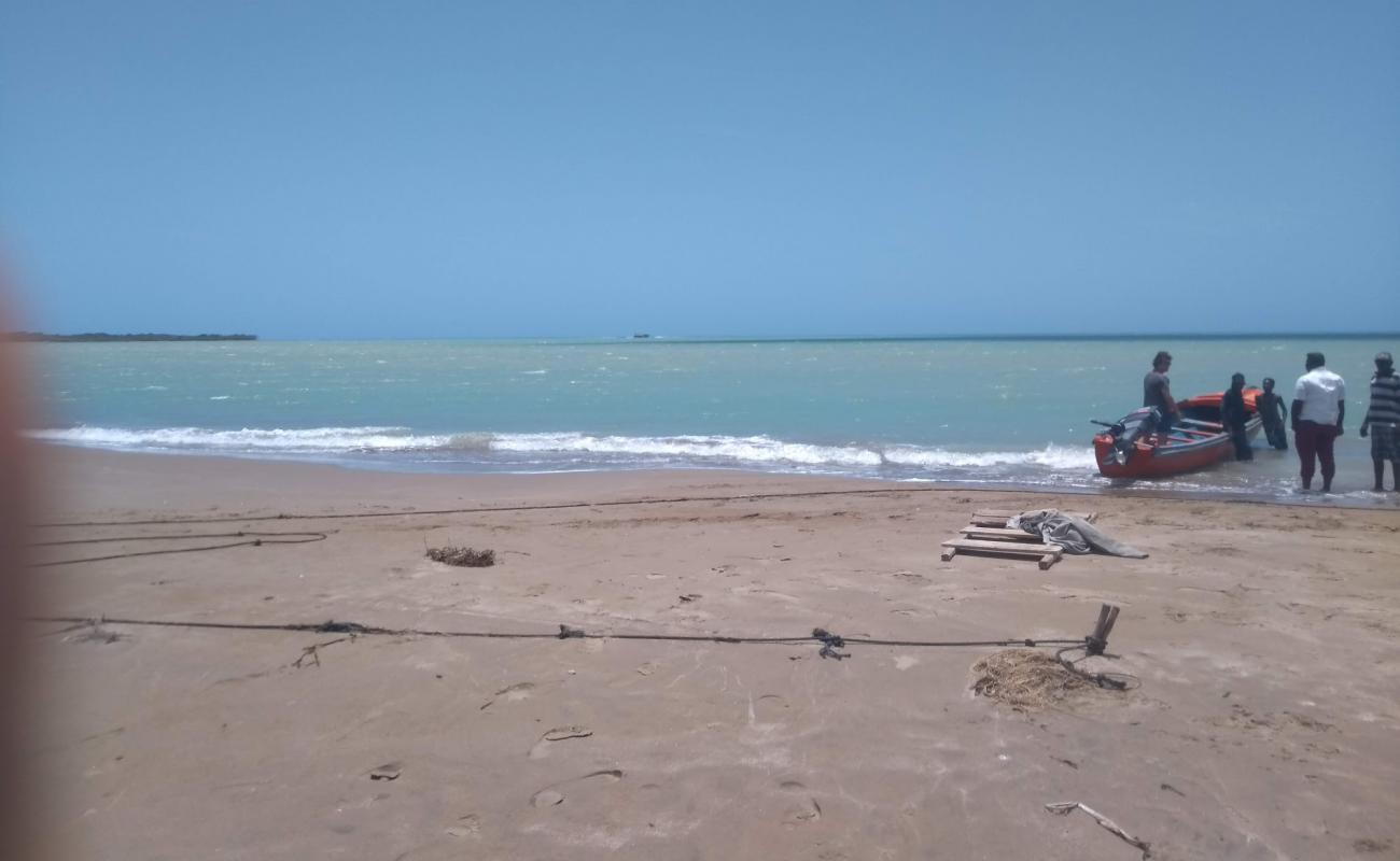 Photo de Parottee Bay avec sable beige de surface