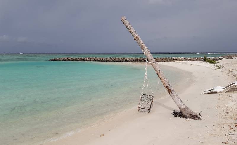 Photo de Huraa beach avec sable lumineux de surface