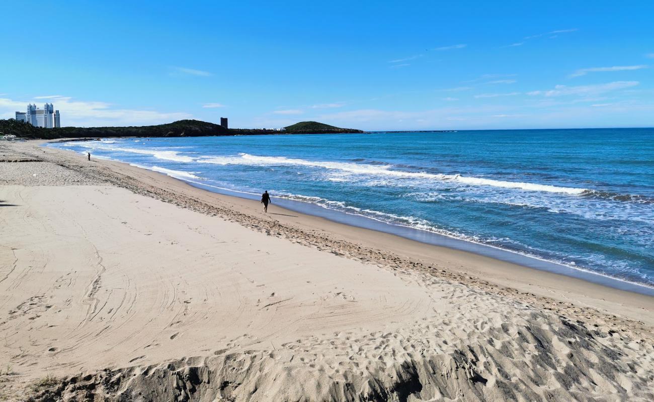 Photo de La Escopama beach avec sable lumineux de surface