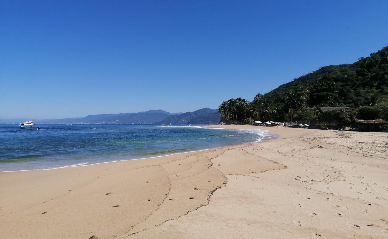 Photo de Quimixto beach avec sable beige de surface