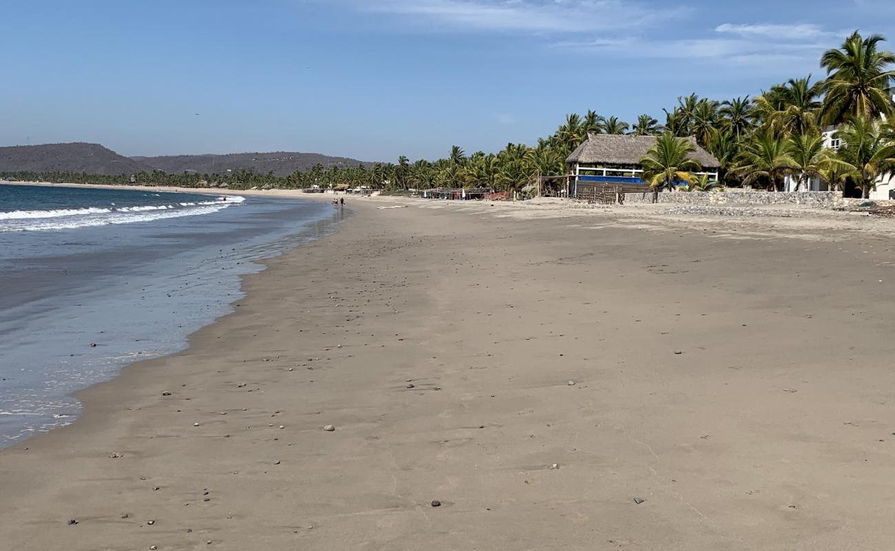 Photo de Playa La Manzanilla avec sable fin brun de surface