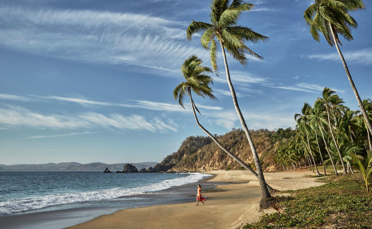 Photo de Playa El Tamarindo II avec sable fin marron de surface