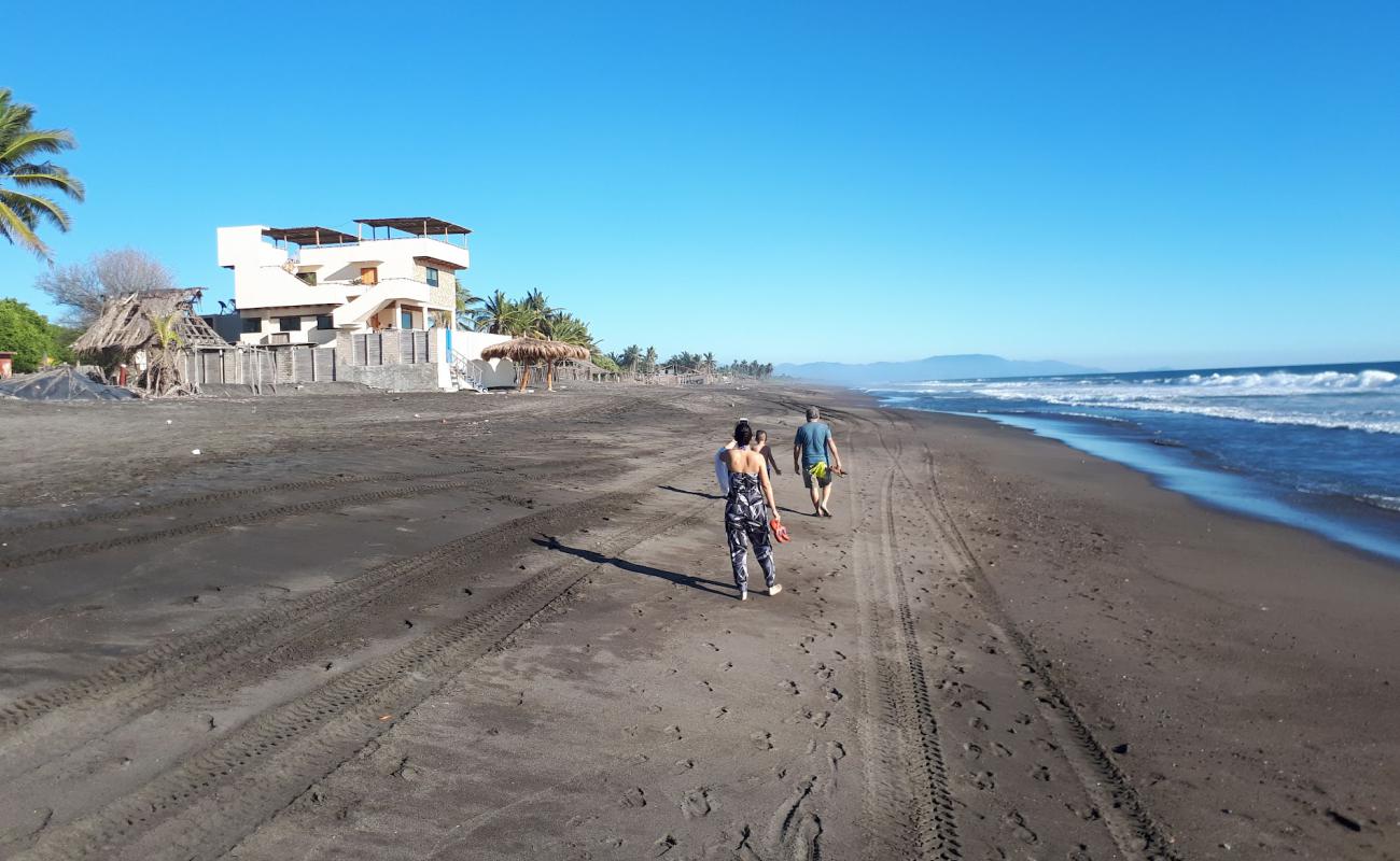 Photo de Playa El Real avec sable brun de surface