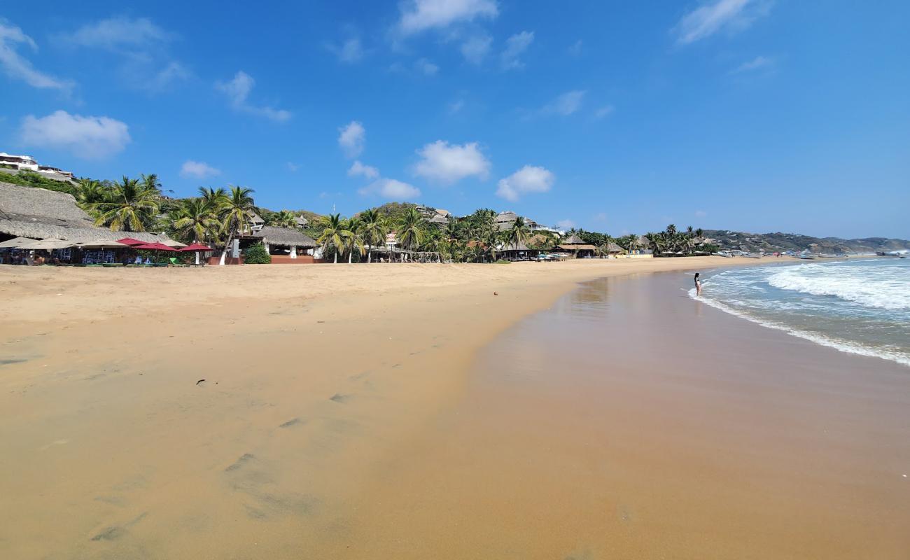 Photo de Playa San Agustinillo avec sable fin et lumineux de surface