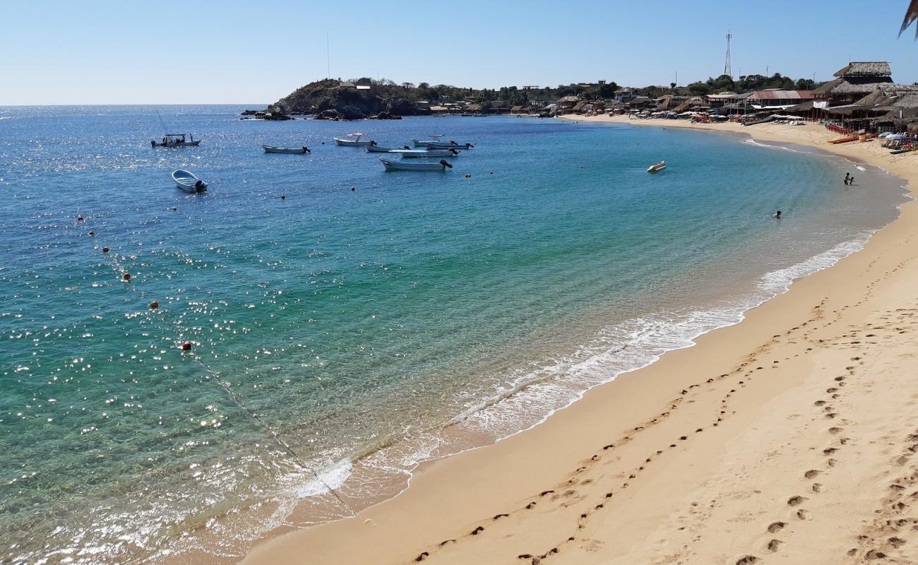 Photo de San Agustin beach avec sable beige fin de surface