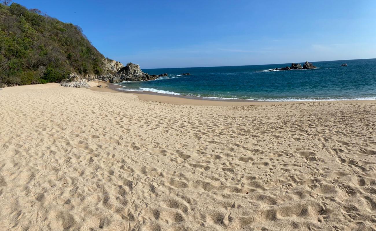 Photo de Punta Arena beach avec sable fin et lumineux de surface