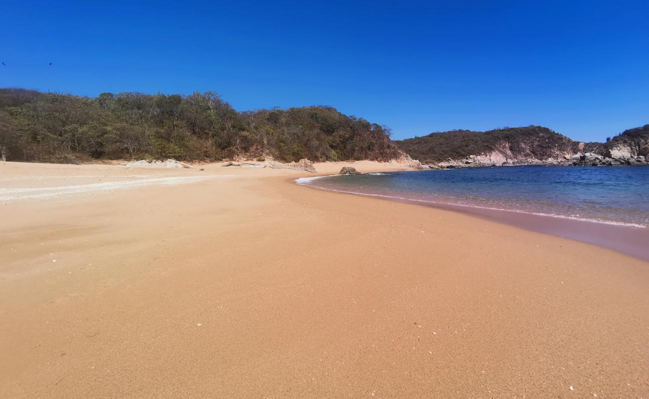 Photo de Magueyito beach avec sable lumineux de surface